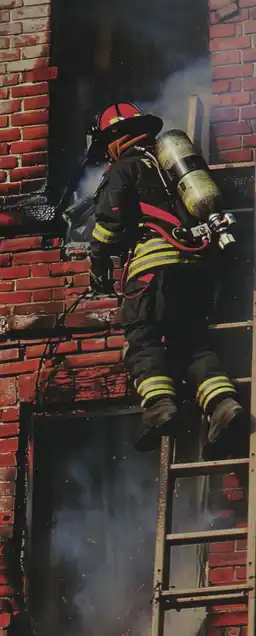 firefighter breaching into a burning building