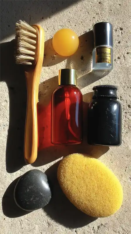 Flat lay of minimal skincare products on a light stone surface, soft shadows and diffused natural light highlighting smooth textures and clean design