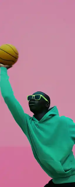 black athlete wearing nike shoes and hoodie and sunglasses shooting a basketball