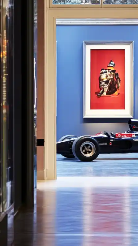 a racing car standing in a barrok gallery