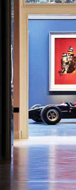 a racing car standing in a barrok gallery